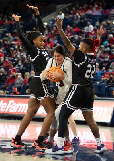 Gonzaga's Melody Kempton (33) is doubleteamed by Stephan F. Austin's Aiyana Johnson (21), left, and Zya Nugent (22) in their non-conference matchup Sunday, Dec. 12, 2021 at the McCarthey Athletic Center at Gonzaga University in Spokane, Washington.  (JESSE TINSLEY)