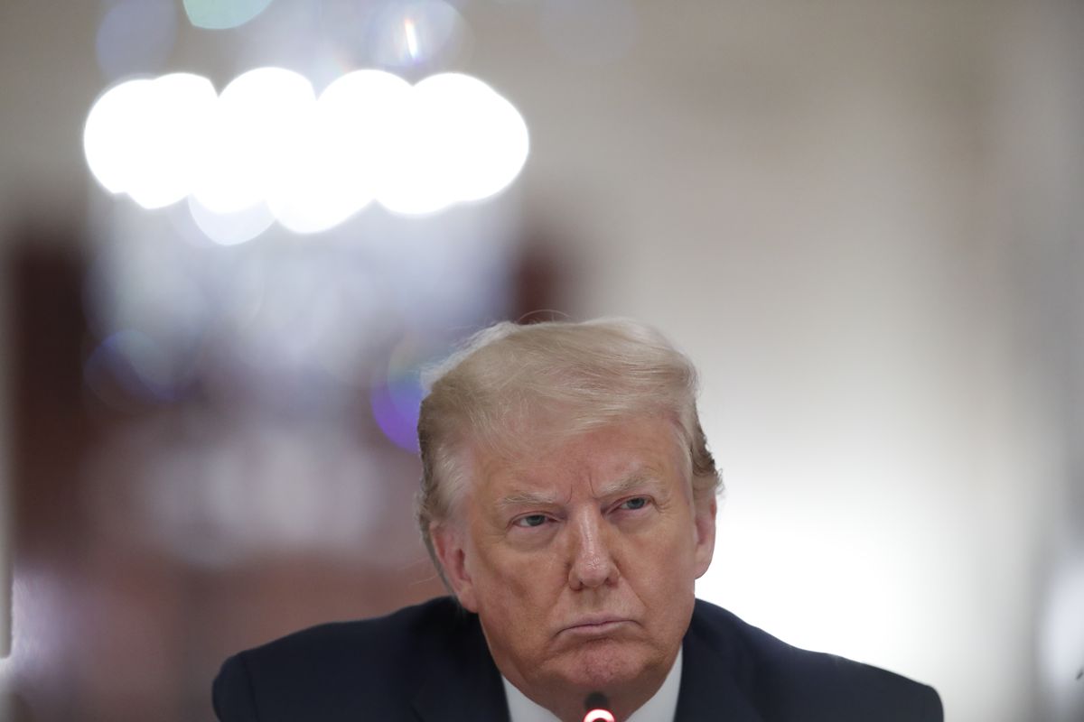 President Donald Trump listens Tuesday during a “National Dialogue on Safely Reopening America’s Schools,” event in the East Room of the White House.  (Associated Press)