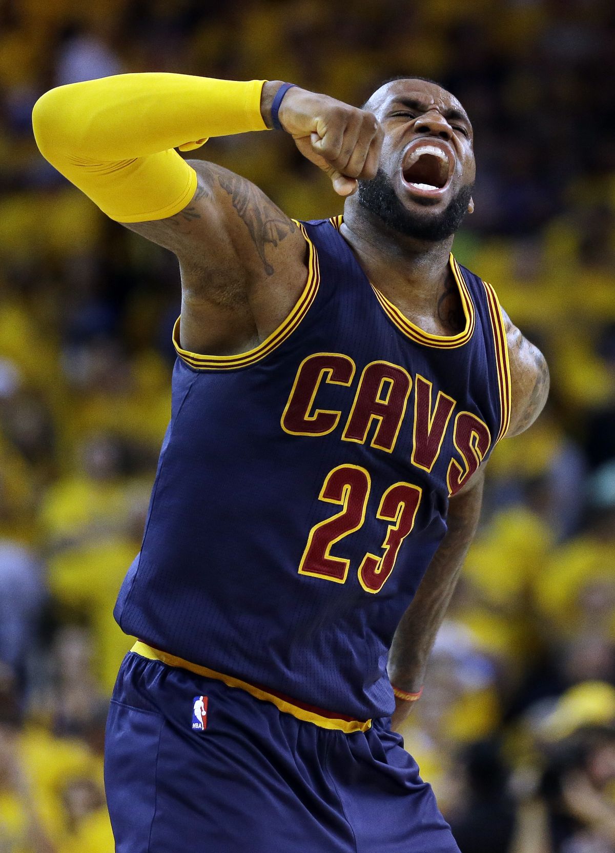 LeBron James, who had 39 points, 16 rebounds and 11 assists, lets his emotions loose after victory. (Associated Press)