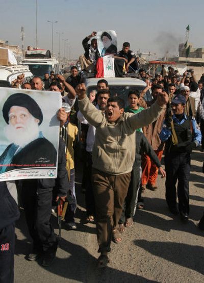 
Friends and relatives  take part in the Baghdad funeral procession Monday for victims of  an attack Sunday in Sadr City. 
 (Associated Press / The Spokesman-Review)