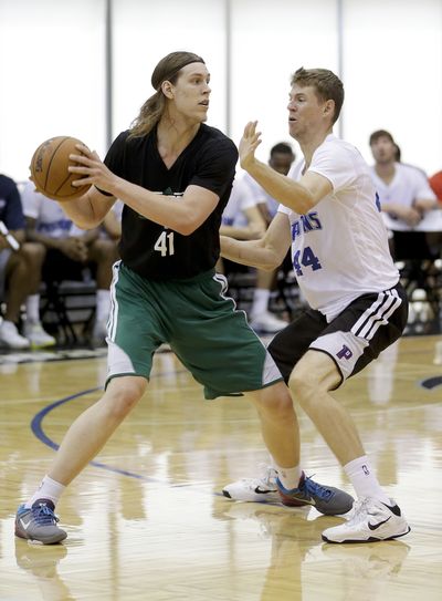 Boston Celtics' Kelly Olynyk, left, showed off his offensive game in summer league play. (Associated Press)