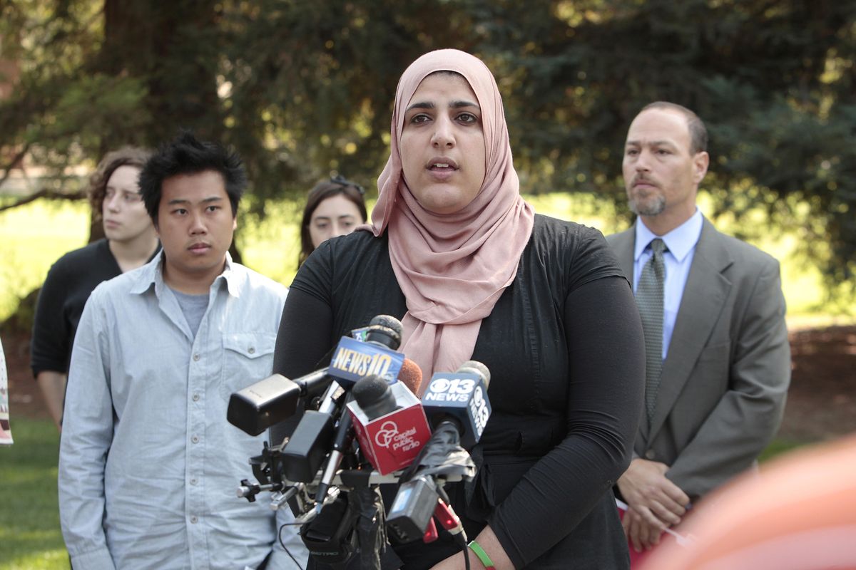 Fatima Sbeih, who was one of the students pepper-sprayed by University of California, Davis police last November, discusses the terms of the settlement reached between students and the school, during a news conference at the campus in Davis, Calif., Wednesday, Sept. 26, 2012.   Under settlement agreement each of the 21 students  and alumni involved will receive a formal written apology from UC Davis Chancellor Linda Katehi and $30,000 from the $1 million settlement from the university. (Rich Pedroncelli / Associated Press)