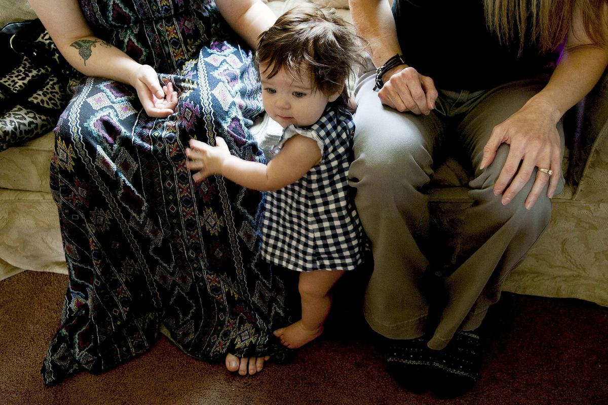 Arya Lewis, 8 months, and her mother Cory Campbell, left, are visited by nurse Jenni Hughes, right, at their home Monday in Rathdrum. Panhandle Health District offers a program that teams nurses with low-income moms for the first two years of the baby’s life. (Kathy Plonka)