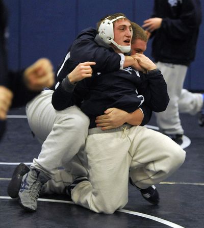Central Valley wrestler Jarod Maynes, front, practices with teammate Dan Schoultz before a match.  (Dan Pelle)