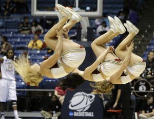 The Florida State cheerleaders perform in the first half of an NCAA Dayton Regional semifinal college basketball game against Mississippi State Sunday, March 28, 2010, in Dayton, Ohio. (Al Behrman / Associated Press)