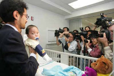 
Baby Yosuke Ohashi gets a lot of media attention Friday at Jackson Memorial Hospital in Miami.
 (Associated Press / The Spokesman-Review)