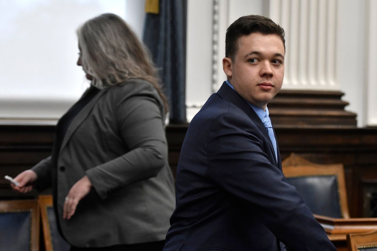 Kyle Rittenhouse, right, looks on as the jury is let out of the room during a break during his trail at the Kenosha County Courthouse in Kenosha, Wis., on Monday. Rittenhouse is accused of killing two people and wounding a third during a protest over police brutality in Kenosha, last year.  (SEAN KRAJACIC)