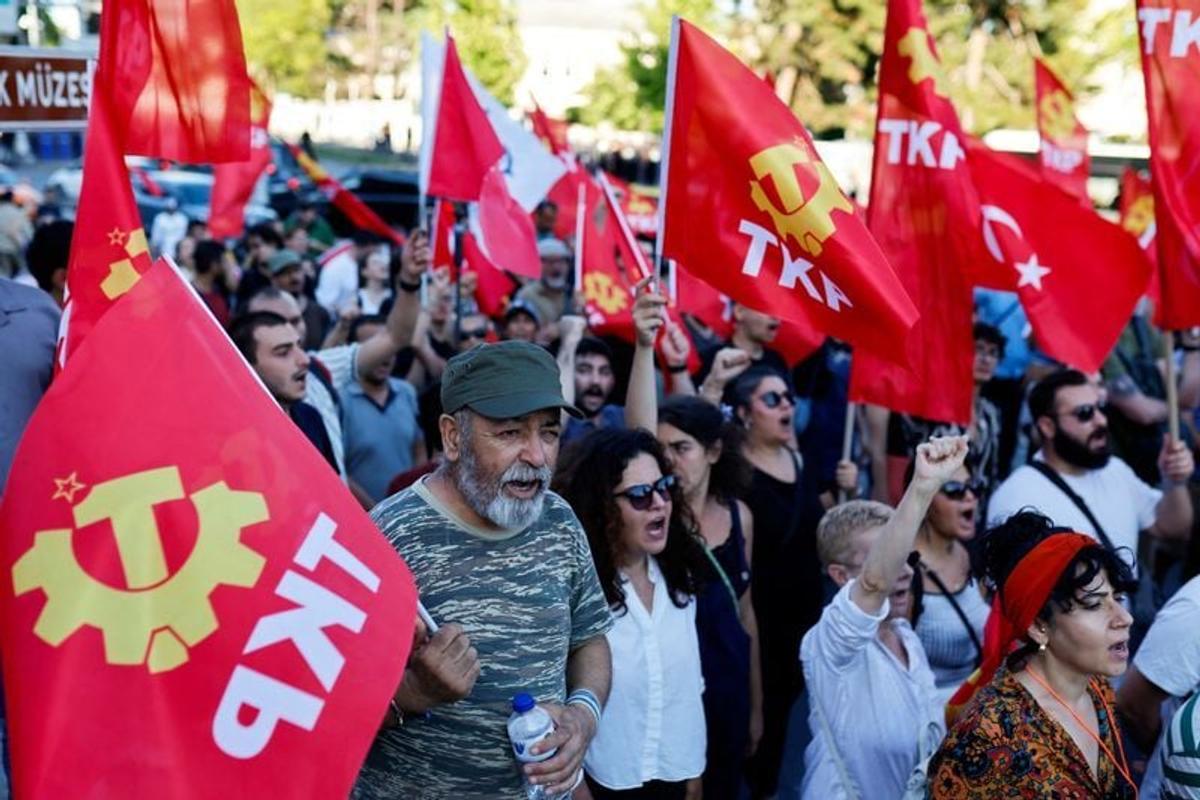 People take part in a protest, ahead of NATO leaders