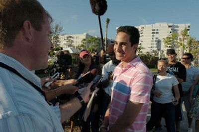 
Farris Hassan, 16, center, a student journalist from Pine Crest School in Fort Lauderdale, Fla., talks to the media across the street from his father's condo in Lauderdale-by- the-Sea, Fla., on Monday. 
 (Associated Press / The Spokesman-Review)