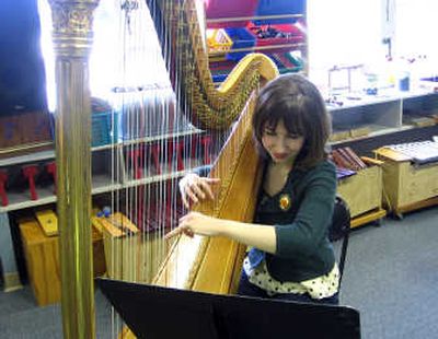 
Melissa Achten, a home-schooled high school senior who lives on Spokane's North Side, is an accomplished harpist. Photo by Shannon Carlson
 (Photo by Shannon Carlson / The Spokesman-Review)