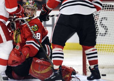 Blackhawks goalie Cristobal Huet can do nothing but watch after Valtteri Filppula scores for Detroit during the second period Sunday. (Associated Press / The Spokesman-Review)