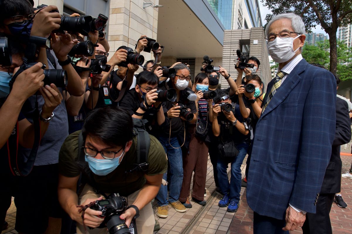 Pro-democracy lawmaker Martin Lee, right, arrives at a court in Hong Kong on Thursday. (Associated Press)