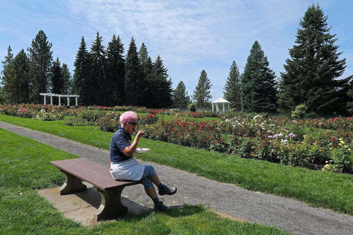 Leslie Kelly eats lunch in the rose garden in Manito Park on Spokane's South Hill.  (John Nelson)