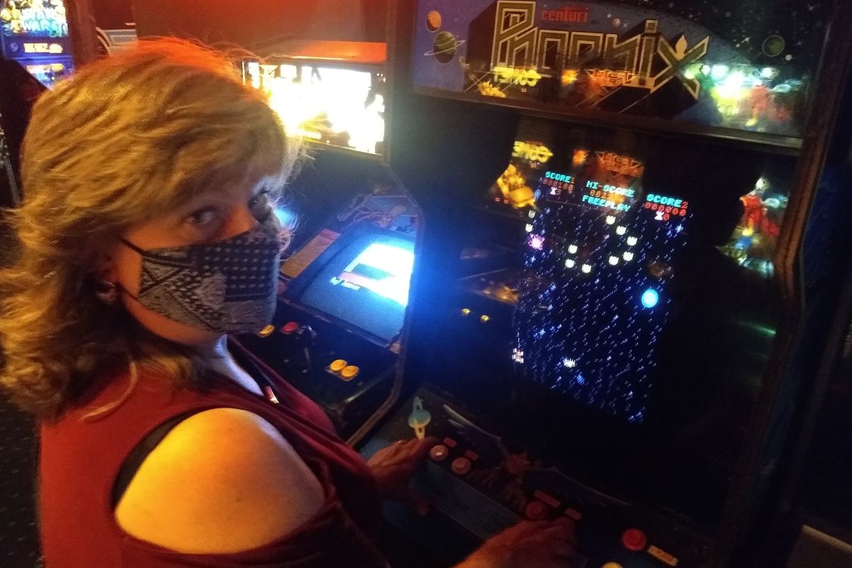 Cindy Hval plays the Phoenix pinball game at Jedi Alliance.  (Courtesy of Cindy Hval)