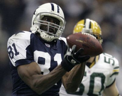 
Dallas' Terrell Owens hauls in a 48-yard reception Thursday night. Associated Press
 (Associated Press / The Spokesman-Review)