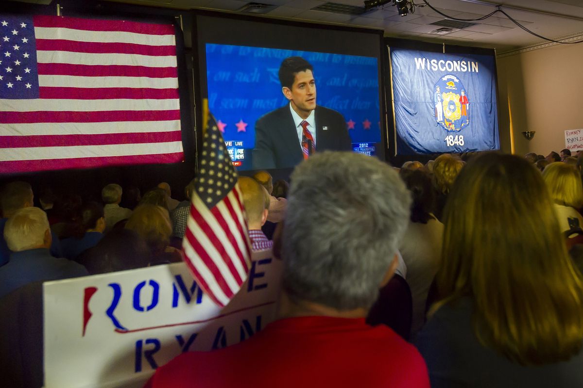 Supporters of Republican vice presidential nominee Rep. Paul Ryan, of Wisconsin, gather at the Holiday Inn Express in Janesville, Wis. to watch his debate with Vice President Joe Biden on Thursday, Oct. 11, 2012. (Mark Kauzlarich / The Janesville Gazette)