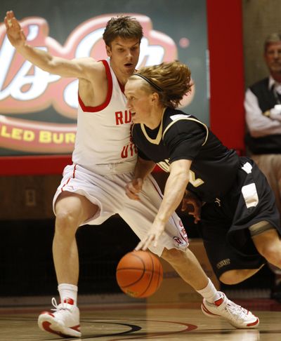 Idaho's Jeff Ledbetter drives on Utah's Luka Drca during an NCAA college basketball game on Friday, Nov. 13, 2009, in Salt Lake City. (Tom Smart / Deseret News)