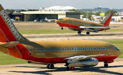 
A Southwest aircraft takes off as another taxi's after landing at Love Field, Monday Oct. 20, 2003, in Dallas. The Airlines Co.'s earnings climbed 41 percent due to strong demand for summer vacation travel, matching Wall Street expectations. A Southwest aircraft takes off as another taxi's after landing at Love Field, Monday Oct. 20, 2003, in Dallas. The Airlines Co.'s earnings climbed 41 percent due to strong demand for summer vacation travel, matching Wall Street expectations. 
 (File/Associated PressFile/Associated Press / The Spokesman-Review)