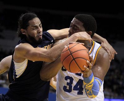 UCLA's Joshua Smith, right, is fouled by Cal's Jorge Gutierrez during the second half of game won by Cal 73-63. (Associated Press)