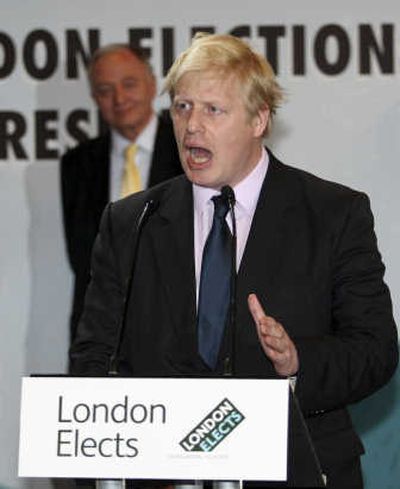 
London's new mayor, Boris Johnson, makes a speech as  outgoing mayor Ken Livingstone listens at City Hall  early  Saturday. Associated Press
 (Associated Press / The Spokesman-Review)