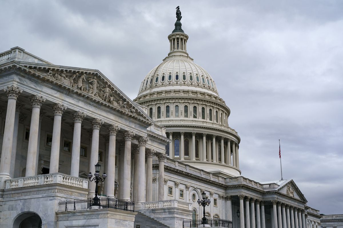 The Capitol is seen as members of the House of Representatives vote on a short-term lift of the nation's debt limit and ensure the federal government can continue fully paying its bills into December, at the Capitol in Washington, Tuesday, Oct. 12, 2021.  (J. Scott Applewhite)