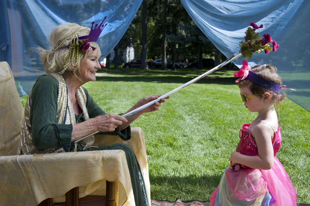 Theodora Salle, as Queen Oceana, bestows the title of “Lady Harper of the Order of Duncan” upon Harper Sprague, 3, during the Children’s Renaissance Faire on Saturday in Manito Park. Participants were offered fairy crafts, storytelling, face painting, balloons from Slinky the Clown and harp music. (Dan Pelle)