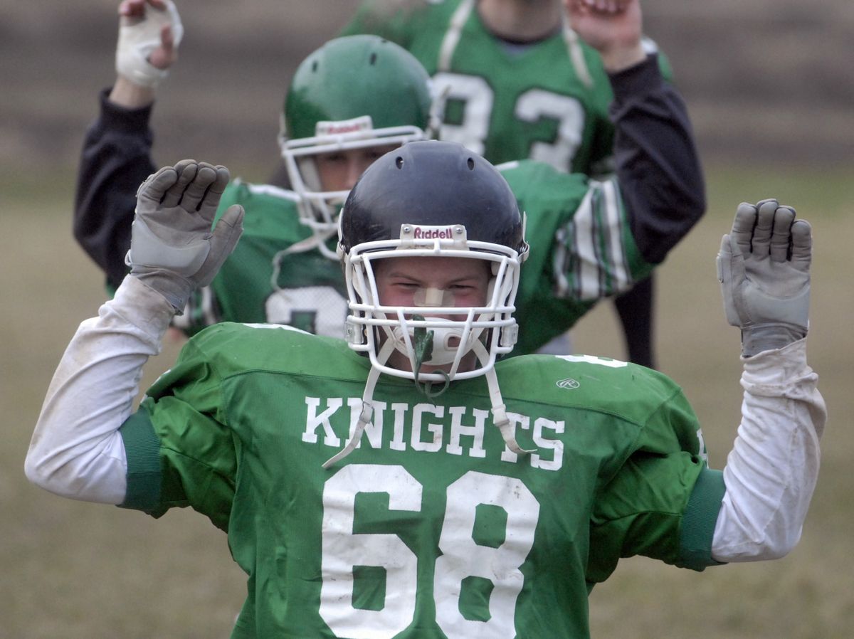 Nate Guthrie’s season for East Valley has seen a switch to middle linebacker and the honor of wearing a black helmet.  (J. Bart Rayniak / The Spokesman-Review)