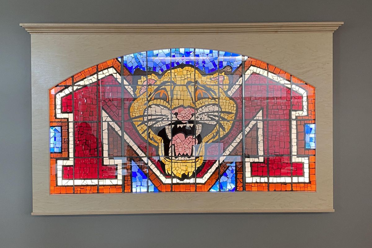 A stained glass window with a wildcat head is hanging in the Mead School District maintenance facility. It was rescued from storage by the director of maintenance and a crew that included a painter, electrician and two carpenters. (Mead School District / Courtesy photo)