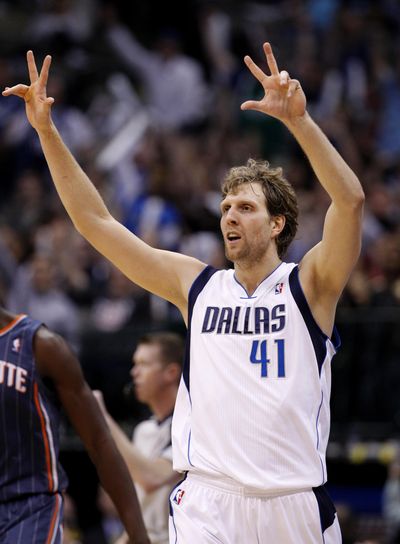 Dallas Mavericks’ Dirk Nowitzki, of Germany, celebrates a three-point basket in the second half of an NBA basketball game against the Charlotte Bobcats, Thursday, March 15, 2012, in Dallas. (Tony Gutierrez / Assocaited Press)