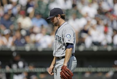 Seattle Mariners starter R.A. Dickey allowed eight earned runs in two innings.  (Associated Press / The Spokesman-Review)