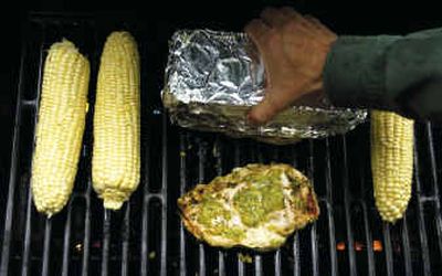 
Grilling chicken breasts under a foil-covered brick is one of the techniques 