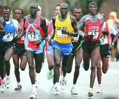 
Winner Robert Cheruiyot, center, leads a pack of elite runners in Brookline, Mass., during the 111th Boston Marathon.  
 (Associated Press / The Spokesman-Review)