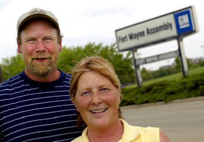 
Bill and Cheryl Krueger stand at the entrance to the GM assembly plant in Fort Wayne, Ind. Cheryl has 11 years in with the company and took the $140,000 buyout. Her husband is staying on until he retires because he has 25 years in with the company. 
 (Associated Press / The Spokesman-Review)