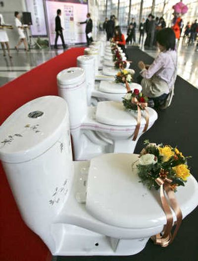
Workers decorate toilets  Thursday in Seoul  as the World Toilet Association kicked off its inaugural conference.Associated Press
 (Associated Press / The Spokesman-Review)