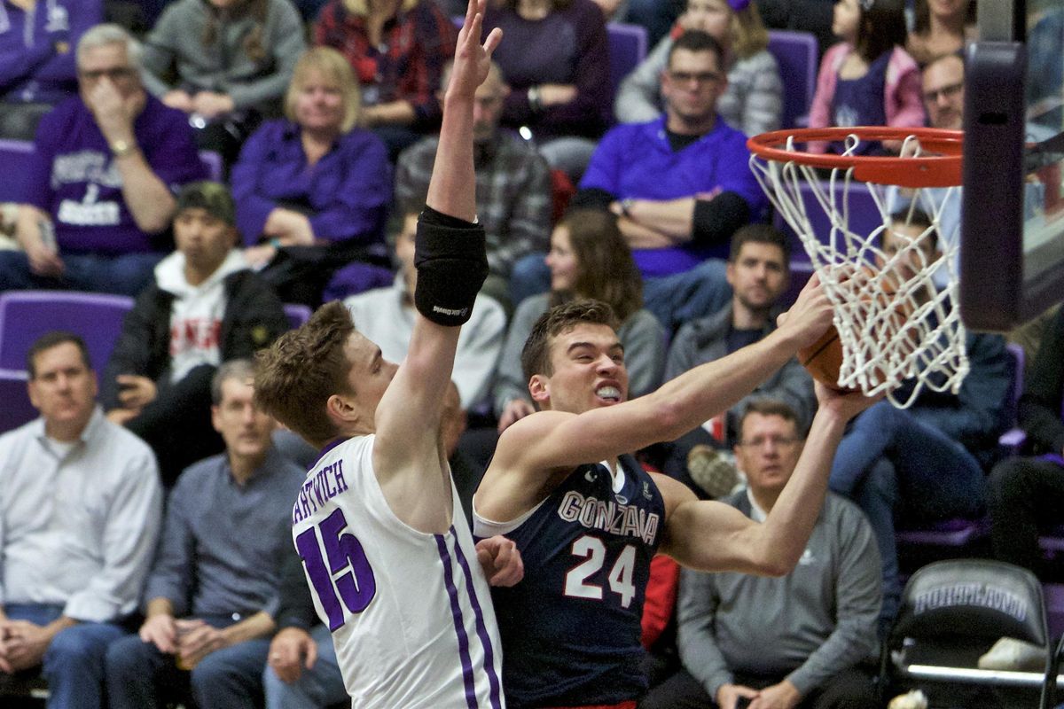 Gonzaga wing Corey Kispert powers inside against Portland center Philipp Hartwich during the first half Thursday. (Craig Mitchelldyer / Associated Press)