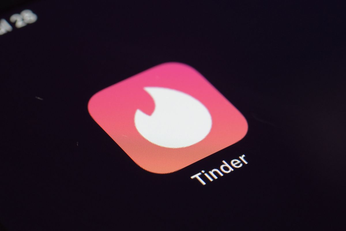 FILE - This Tuesday, July 28, 2020, file photo shows the icon for the Tinder dating app on a device in New York. The use of dating apps in the last 18 months of the pandemic has surged around the globe. Tinder reported 2020 as its busiest year.  (Patrick Sison)