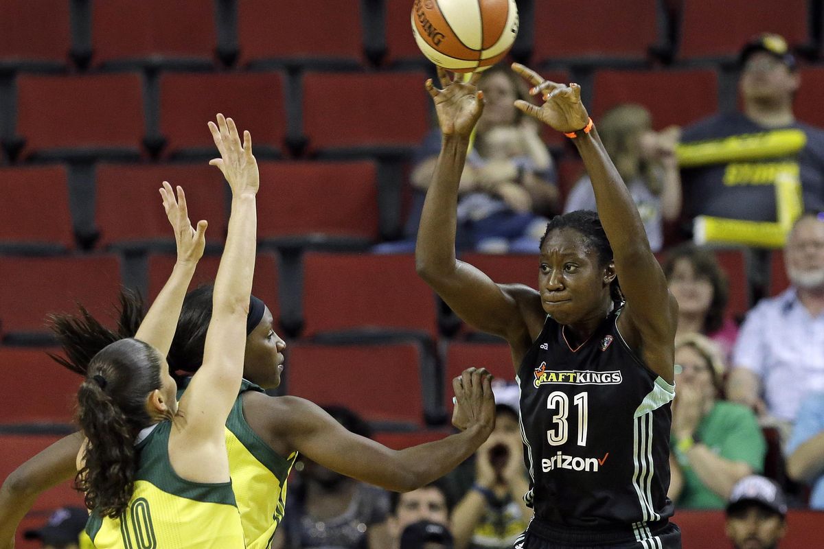 New York Liberty’s Tina Charles (31) throws a pass as Seattle Storm’s Sue Bird (10) and Crystal Langhorne defend during the second half of a WNBA basketball game Thursday, July 6, 2017, in Seattle. The Liberty won 79-70. (Elaine Thompson / Associated Press)