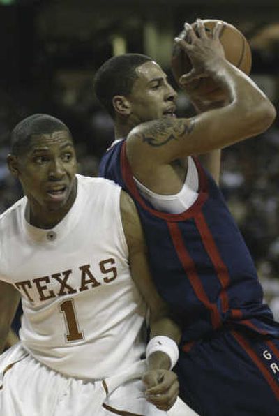 
Saint Mary's forward Diamon Simpson beats Texas' Gary Johnson to a rebound. Associated Press
 (Associated Press / The Spokesman-Review)