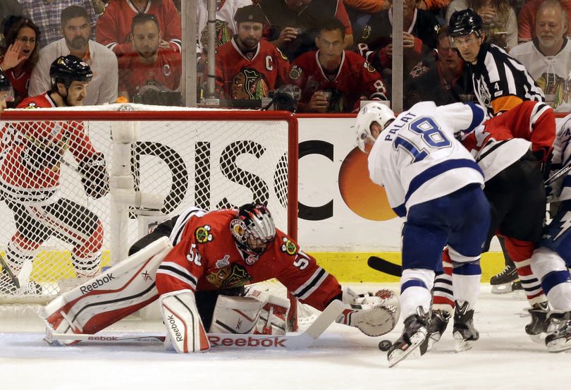 Ondrej Palat scores past Blackhawks goalie Corey Crawford during third period in Tampa Bay’s 3-2 victory over Chicago in Game 3. (Associated Press)