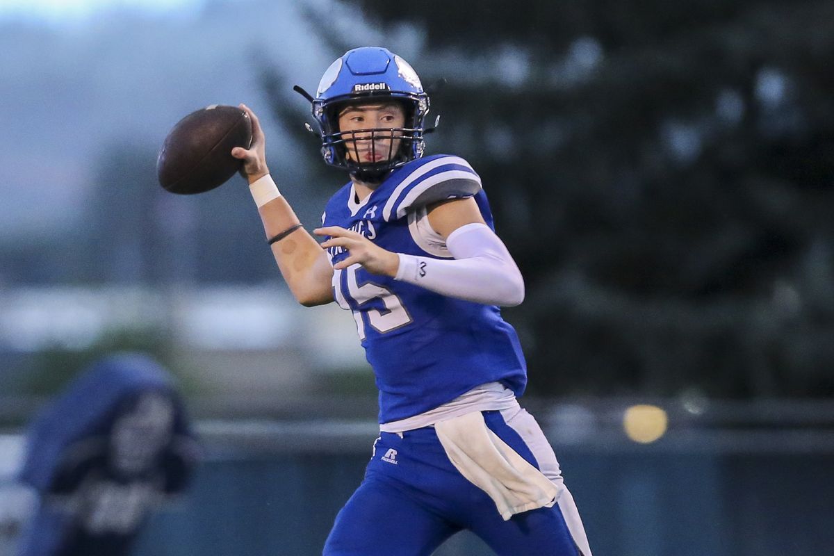 Coeur d’Alene quarterback Caden Symons loads to throw one of his 29 pass attempts against visiting Rigby on Friday. CdA won 24-14.  (Cheryl Nichols/For The Spokesman-Review)