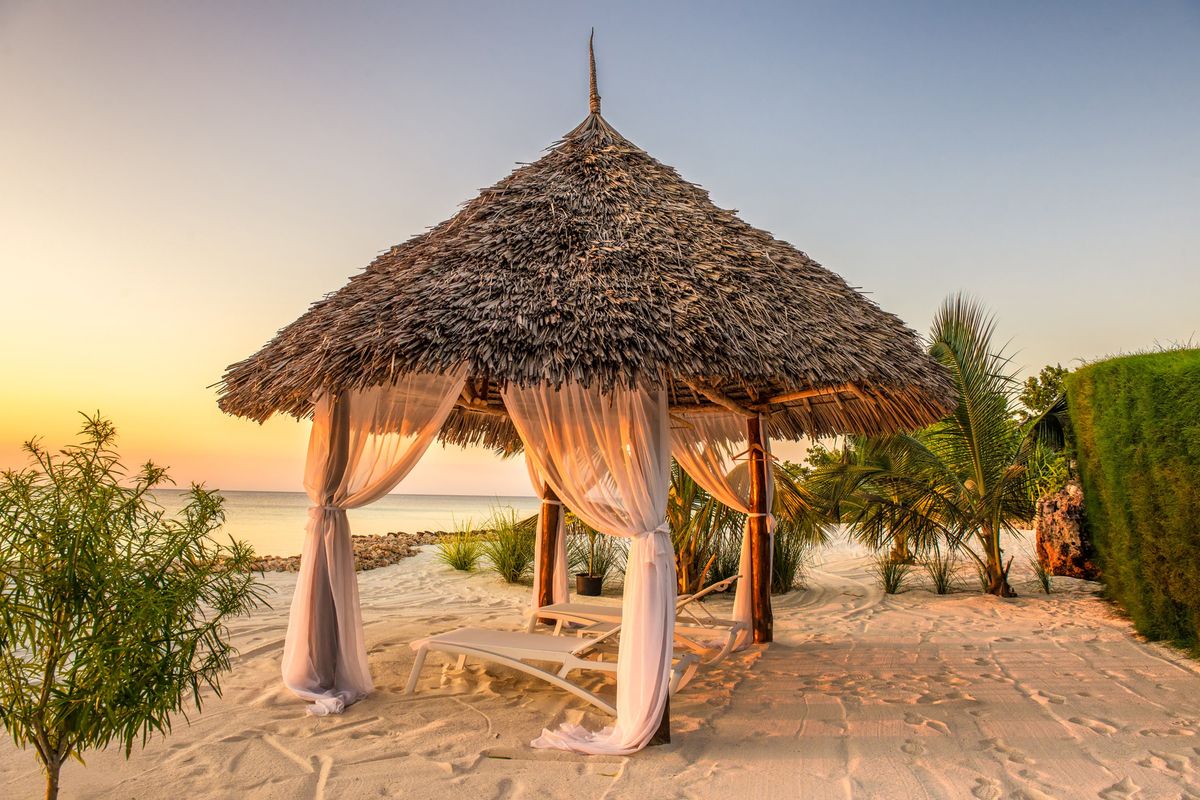 Beach lounge chairs at sunset, Zanzibar, Tanzania. (Dreamstime/TNS)  (Dreamstime/Dreamstime/TNS)