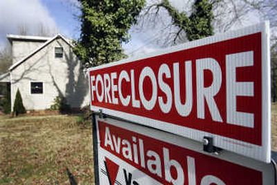 
A foreclosure sign is seen on the lawn of a home in Egg Harbor Township, N.J., in March.Associated Press
 (File Associated Press / The Spokesman-Review)