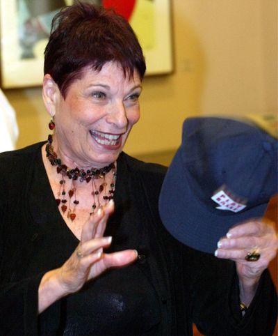 In this Aug 25, 2003 file photo, Portland Mayor Vera Katz smiles as she holds a baseball cap following a news conference in Portland, Ore. (Rick Bowmer / Associated Press)