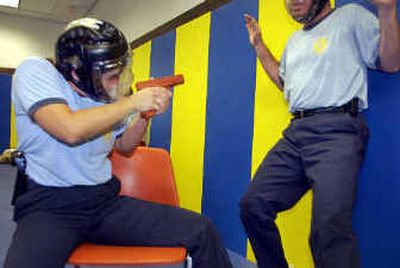 
Volunteer pilots train to disarm a potential hijacker during in a weapon retention class at the Federal Law Enforcement Training Center in Brunswick, Ga., in this April 2003 file photo. After limping along, the pace of training and deployment of armed pilots on commercial flights has picked up. But supporters say the Bush administration is making it unnecessarily difficult to get guns in the cockpit. 
 (Associated Press / The Spokesman-Review)