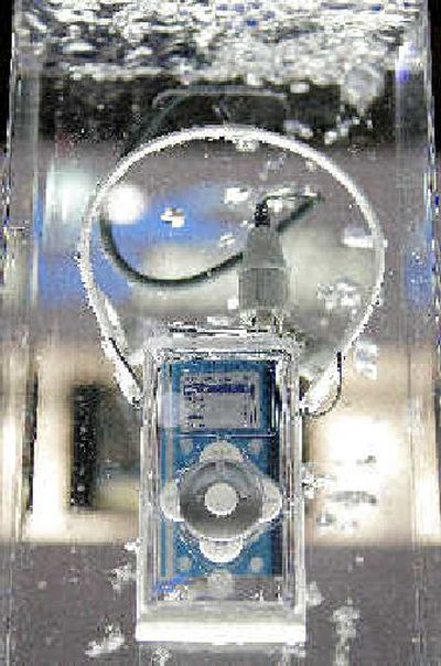 
A waterproof iPod case and a headset manufactured by H20 Audio.
 (The Spokesman-Review)