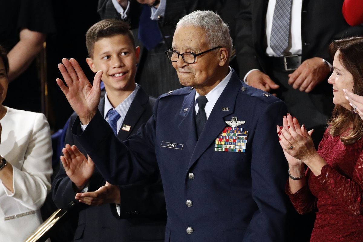 Tuskegee airman Charles McGee and his great grandson Iain Lanphier react as President Donald Trump delivers his State of the Union address to a joint session of Congress on Capitol Hill in Washington, Tuesday, Feb. 4, 2020. McGee, one of the last surviving Tuskegee Airmen who flew 409 fighter combat missions over three wars, died Sunday, Jan. 16, 2022. He was 102. (Patrick Semansky)