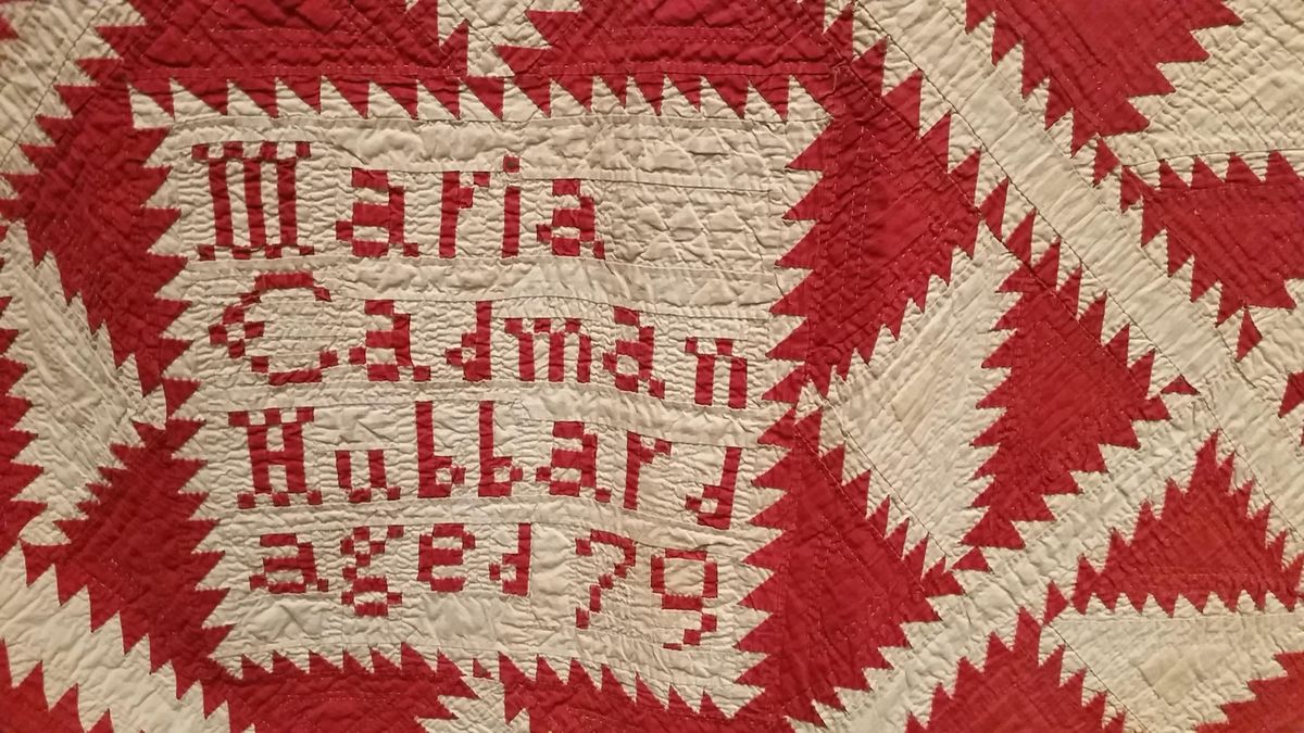 In this June 30, 2016 photo, detail from an 18th century quilt is displayed in the exhibit American Made: Treasures from the American Folk Art Museum at the Crystal Bridges Museum of American Art in Bentonville, Ark. Exhibit organizers say that, at the time the quilt was made, women held few rights and that the inclusion of her name in bold lettering was a declaration. The exhibit of material from everyday Americans is on display through mid-September. (AP Photo/Kelly P. Kissel) ORG XMIT: NYLS228 (Kelly P. Kissel / AP)