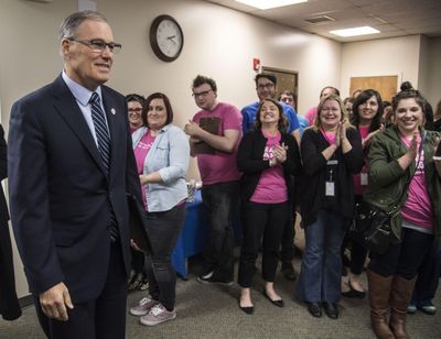 Washington Gov Jay Inslee is greeted as he enters Planned Parenthood of Greater Washington and North Idaho, Friday, Feb. 3, 2017, in Spokane. (Dan Pelle / The Spokesman-Review)