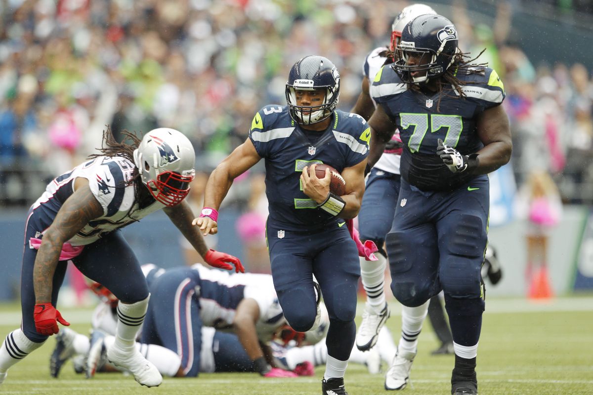 Using some zone-read concepts has allowed the Seahawks to capitalize on Russell Wilson’s (3) running ability. (Associated Press)