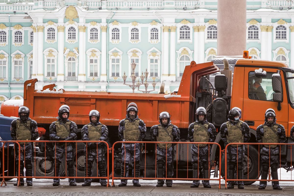 Russian Rosguardia (National Guard) soldiers stand blocking enter to the Palace Square a day before Sunday